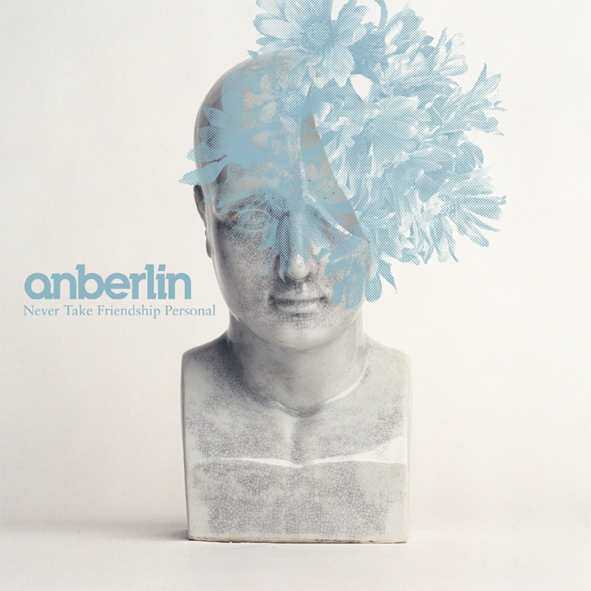 Album Art of Anberlin's Never Take Friendship Personal album - On a white background and table, a marble-looking bust with the top half of the head missing on the right side--it looks like it was broken off and we can see it's hollow. Overlaid on top of this picture is some blue flowers in such a way that they look like they are stuck inside the bust and protruding out the missing part of the bust.