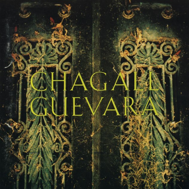 Album Art of Chagall Guevara's self-titled album - A photo of two green gate doors with a decorative design cut through them. There are plants growing through the holes and around the gates, so it seems like the place is abandoned or unused. Nothing but darkness can be seen behind the gates. In front of the photo is printed the band name in very large, green letters.