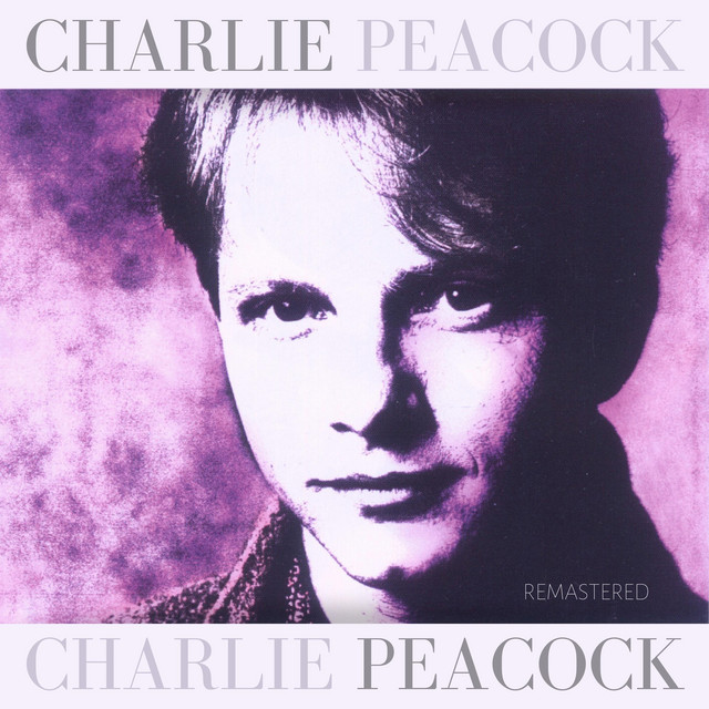 Album Art of Charlie Peacock's self-titled album - At the top and the bottom, a light purple strip has the artist name printed in both places, as one is probably the artist name and the other the album name. On the top, the first name is darker, and the last name is lighter, and it's reversed on the bottom. In the middle is a picture of a white man with short hair and a slight smile in front of a purple background. The whole photo is only white and various shades of purple.