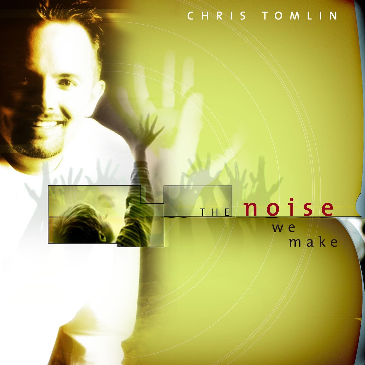 Album Art of Chris Tomlin's The Noise We Make album - A smiling young man with short facial hair and pretty short spikey hair is pictured on the left in a white shirt. On the right is mostly just a yellow-ish green background. At the top in white letters is the artist name, and in the lower middle on the right is the album title in a dark red. A small photo of someone raising their hands and looking to the heavens is included, with the silhouette of raised hands repeated around the photo.