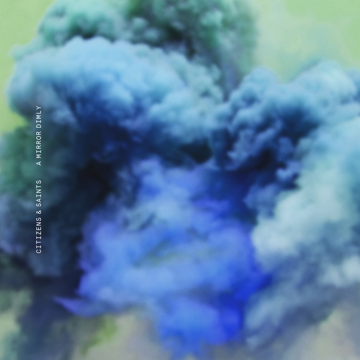 Album Art of Citizens's A Mirror Dimly album - On a green background, blurry blue smoke clouds of various shades are billowing from the bottom. On the left side, printed vertically in small white letters is 'Citizens & Saints' (their band name at the time of release) and then the album title.