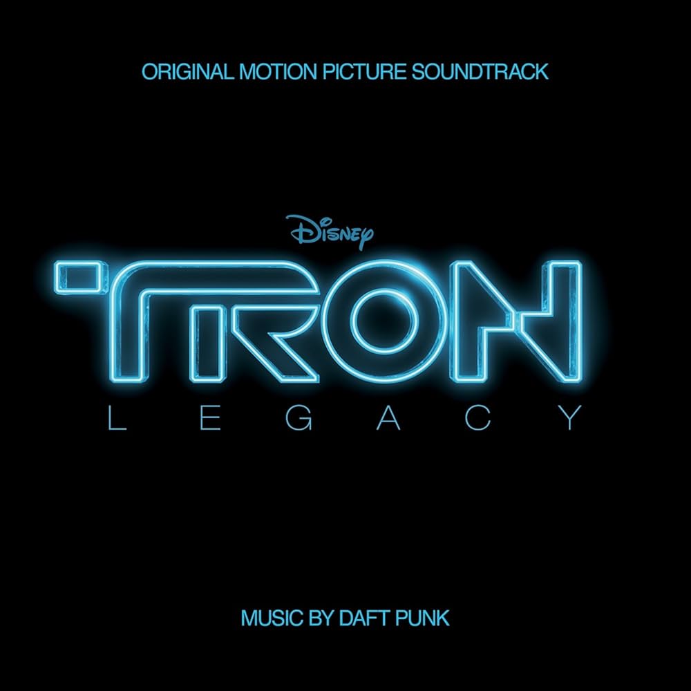 Album Art of Daft Punk's TRON Legacy Soundtrack album - In the middle, the Disney logo is printed in blue above a bigger TRON logo, what looks like glowing shiny metal bits that form the letters. Below that, the words 'Legacy' are written. At the top, 'Original Motion Picture Soundtrack' and at the bottom, 'Music by Daft Punk' are written in blue.