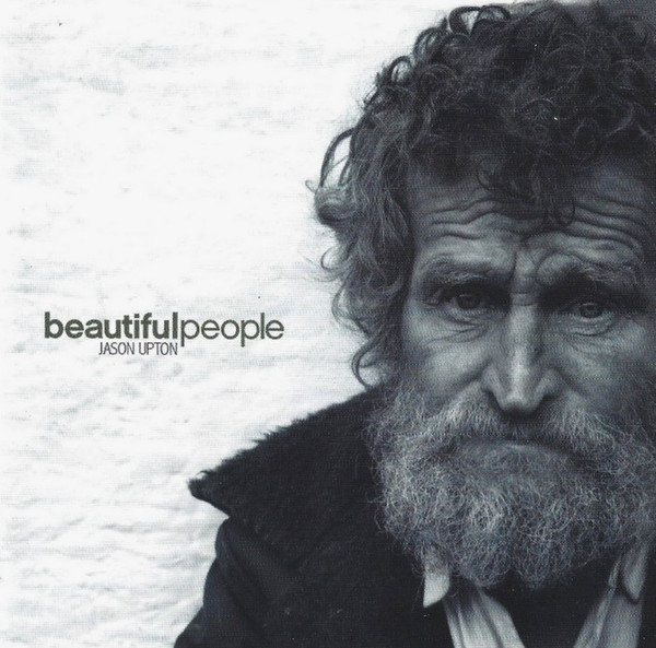 Album Art of Jason Upton's Beautiful People album - On the right is a black-and-white photo of an old man with lots of hair and a beard. He's wearing a shirt and a large, dark coat. Behind him is some sort of stucco wall or maybe a paper texture. To the left is the words 'beautiful' in bold and 'people' in regular weight font, no spaces. Below that in smaller font is the artist's name in uppercase, with space between the first and last name.