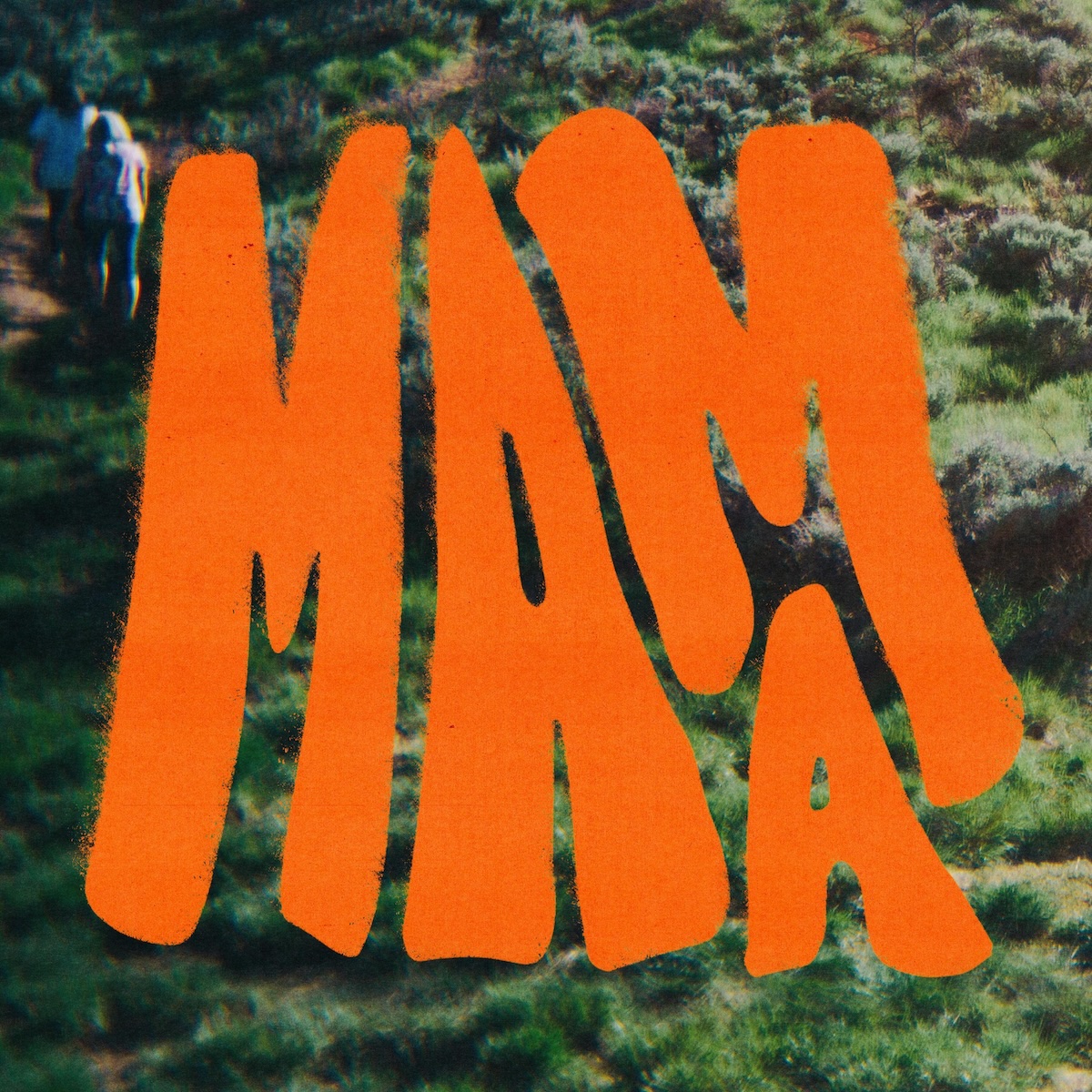 Album Art of Jess Ray's Mama album - A grainy photo of two women climbing a grassy hill, with the two women in the top left. Over the top of the photo, most of the grassy hill cannot be seen because there's a very large, bright orange 'Mama' spray painted on top of the image, taking up most of the space.