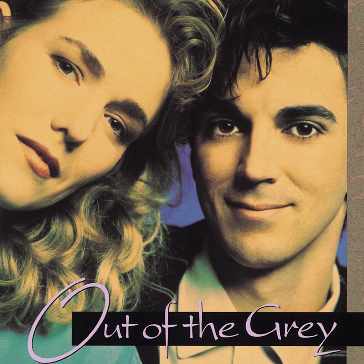 Album Art of Out Of The Grey's self-titled album - A close-up photo of two faces, and either the lighting was very odd or the photo was highly edited. Their faces look a pale orange, though I believe they are white persons, and it looks like the man might be wearing a black suit and the woman a aqua green top, and a deep blue background can be briefly seen between them. The woman is looking into frame from the left and the man is just looking straight on on the right, both looking at the camera. The woman has brown hair and the main has black hair. At the bottom, it has the band name printed in a light pink with a black box behind most of the letters.