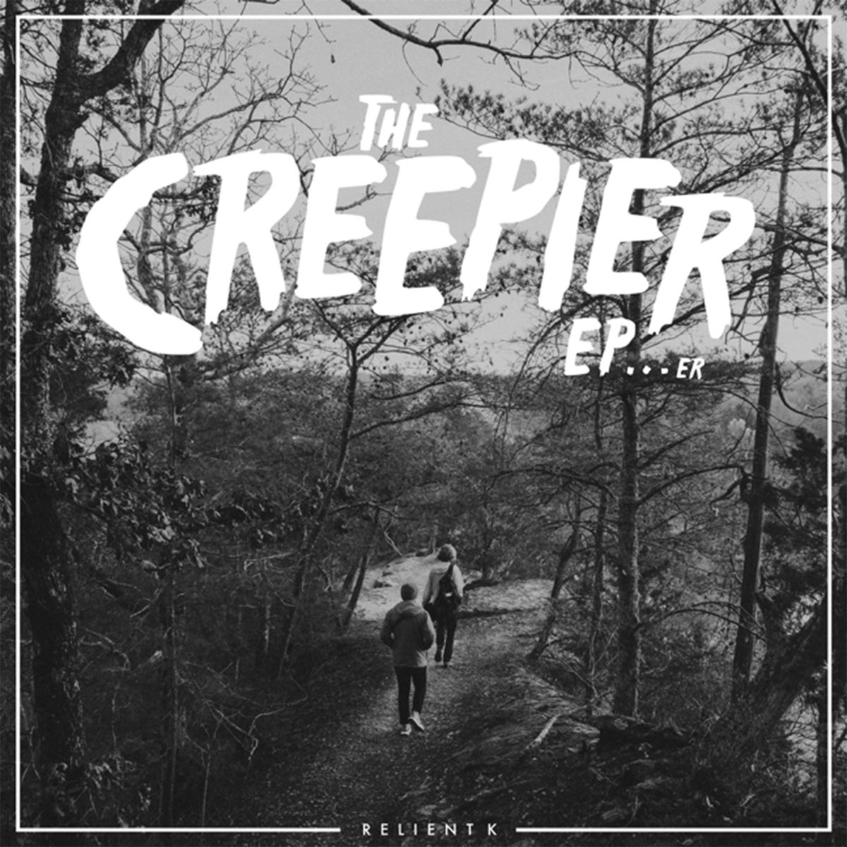 Album Art of Relient K's The Creepier EP...er EP - A black and white photo two men walking into a woods with hoodies and backpacks on. The band's name is in small letters in the bottom and there's a hairline white border that connects with it. The EP's title is printed in white over the sky with a hand-written, bold font.