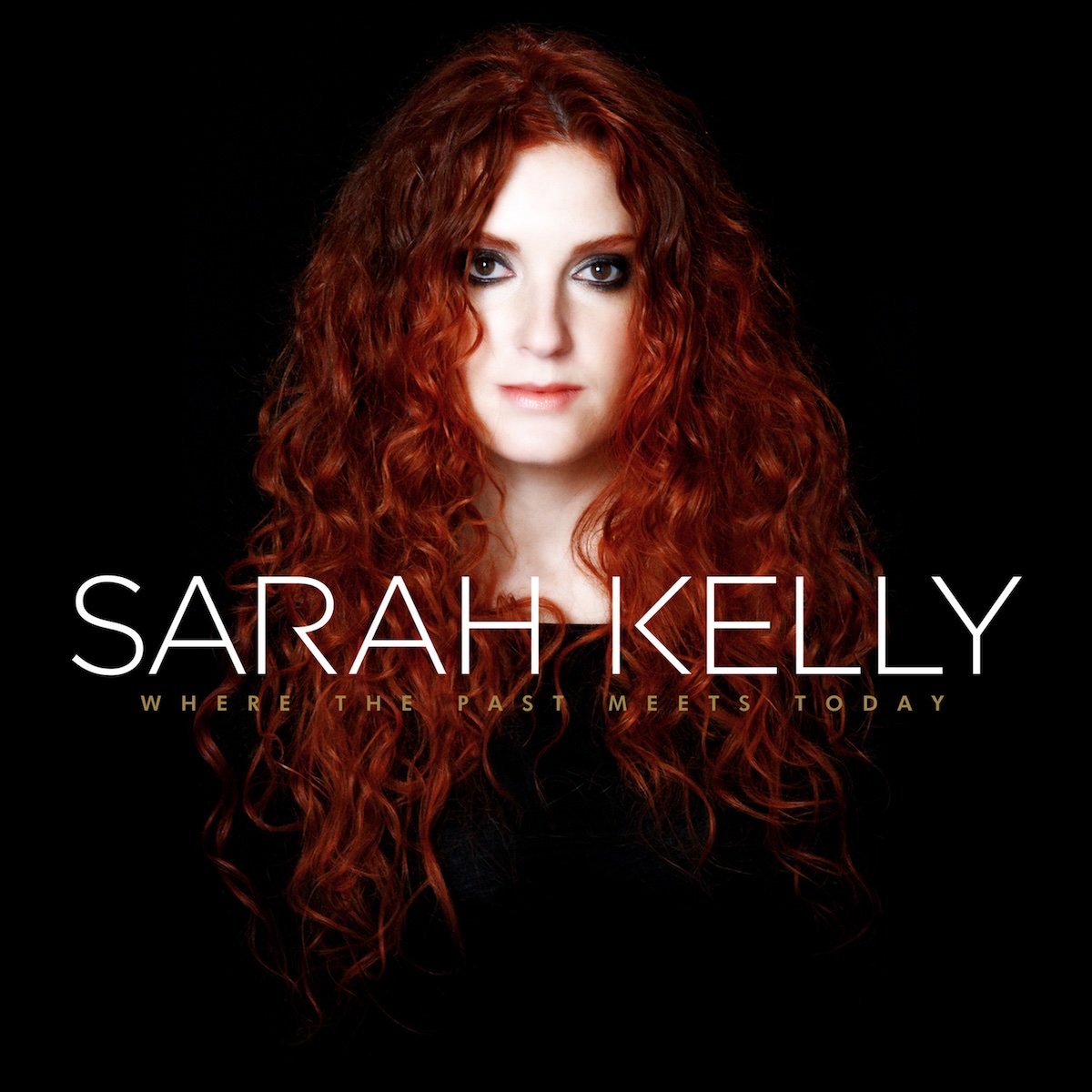 Album Art of Sarah Kelly's Where The Past Meets Today album - On a black background, a photo of a woman in a black dress from the chest up, such that only really her neck and head can be seen in the light, along with her long, curly red hair. She's got a pretty blank look on her face and is looking into the camera. She has pretty dark makeup around her eyes. Just below her neck, printed in large, white, all-caps letters is the artist's name. Below that in much smaller letters is the album title in gold, uppercase letters.