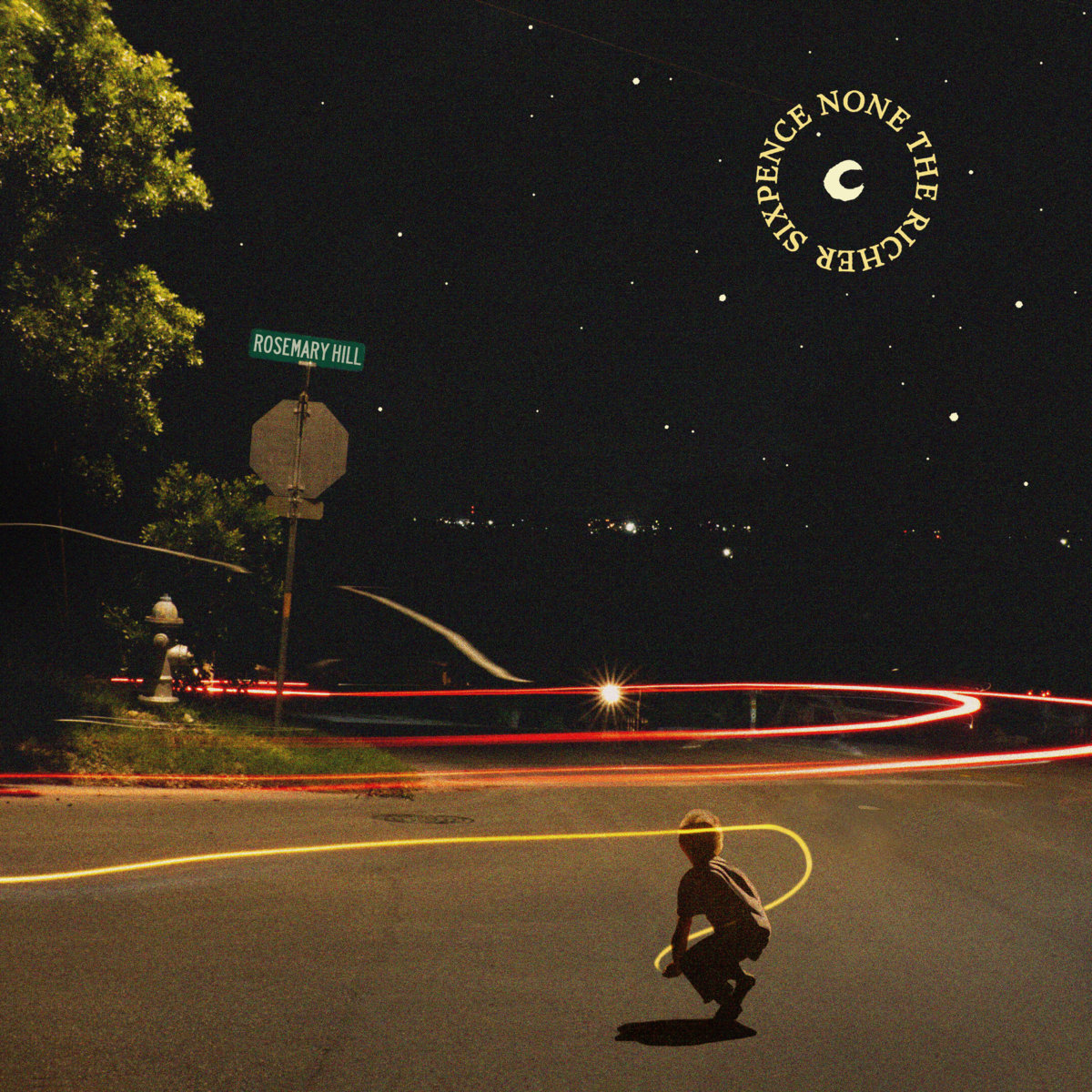 Album Artwork of Sixpence None The Richer's Rosemary Hill EP - A woman with red hair is crouched, facing away from the camera at a night sky and the intersection of a few roads that go off into the night. On the corer is a fire hydrant, a stop sign with a street sign saying 'Rosemary Hill' on it, and a tree. Down the road and to the woman's hand are swirling lights, like it's some sort of time-lapse. In the night sky, what looks like a hand drawn crescent moon is circled by the band's name in a golden white.