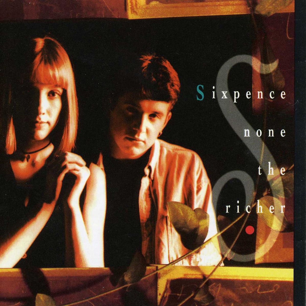 Album Art of Sixpence None The Richer's The Fatherless And The Widow album - A photo of two white people, on the left a woman with shoulder-length red hair, and a man with shorter brown hair on the right. They are both looking wide-eyed into the camera and have a blank expression on their faces. To the right of them is printed the band name on top of the photo in small text, with a large, semi-transparent large 'S' behind the text. At the top and bottom, it seems like the photo is covered by some other cards and a few branches with leaves on them.