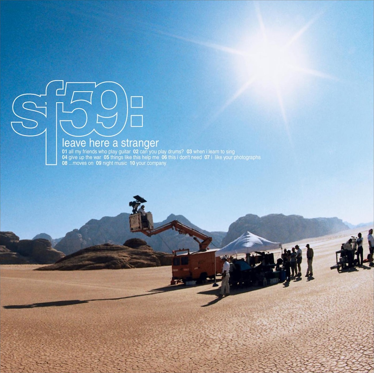 ' in large white outline, with the album title in much smaller lowercase text below it, and then the track listing in even smaller text below that.