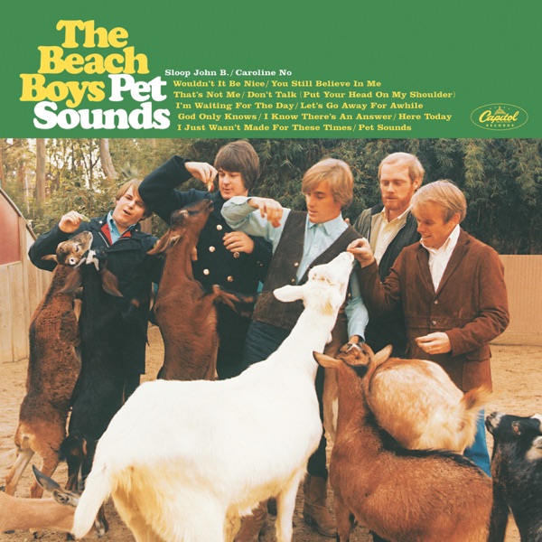 Album Art of The Beach Boys's Pet Sounds album - On the bottom 3/4ths of the cover, a photo of some young men in collared shirts and jackets feeding a bunch of goats or something in what looks like a pen at a farm or something. They look like they're trying to feed them carrots and their expressions are a bit unsure on how well it is going, but the animals do seem to be trying to get the food. The top quarter has a solid green background and has the band name printed in yellow on the left, with the album title right after it as well in white. Next to the title is the list of all the songs. And on the far right, the Capitol Records oval logo in yellow.