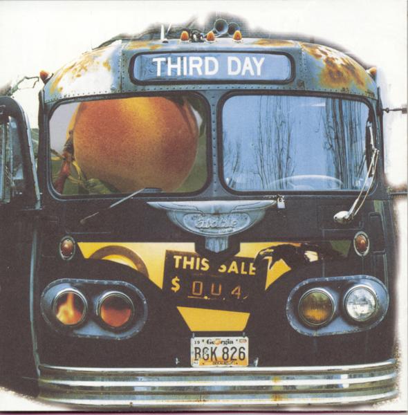 Album Art of Third Day's self-titled album - A photo of the front of an old bus with a Georgia license plate. The contents of the photo around the bus have been whited out, and some parts of the bus have been replaced with other photos. For example, the left window on the front of the bus is replaced with a photo of a peach, and the right window is a photo of a blue-grey sky with bare tree branches stretching up into the sky. The front grille area is replaced with a photo that includes a gold background and a black sign that says, 'This Sale 0.04'. Some of the headlights are also replaced with photos of flames. The sign on the top of the bus says the band name, 'Third Day'.
