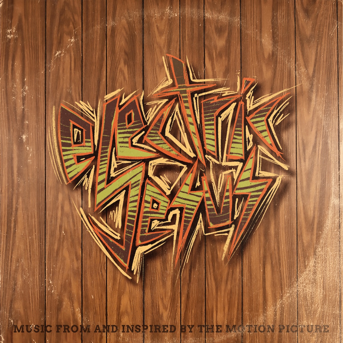 Music From And Inspired By The Motion Picture album - The background looks like wood paneling on an indoor wall. In the middle is a a very metal-looking drawing of the words 'Electric Jesus', with light green and dark brown stripes, orange letter edges, and a pastel gold halo drawn around the edges of the words. The words are in a general circle shape, and there's fake ringwear that might happen with a well-handled record to make it look retro. Along the bottom, it says 'Music From And Inspired By The Motion Picture'.